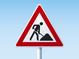 Achtung-Schild mit Bauarbeiter